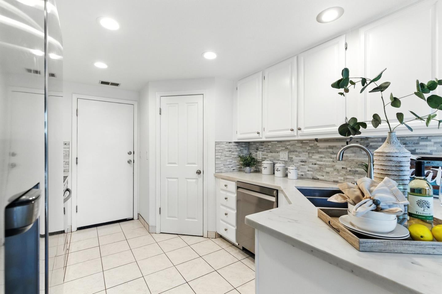 113 East Rincon Avenue Campbell, CA 95008 - Photo 10 of 26 a kitchen with a sink appliances and cabinets