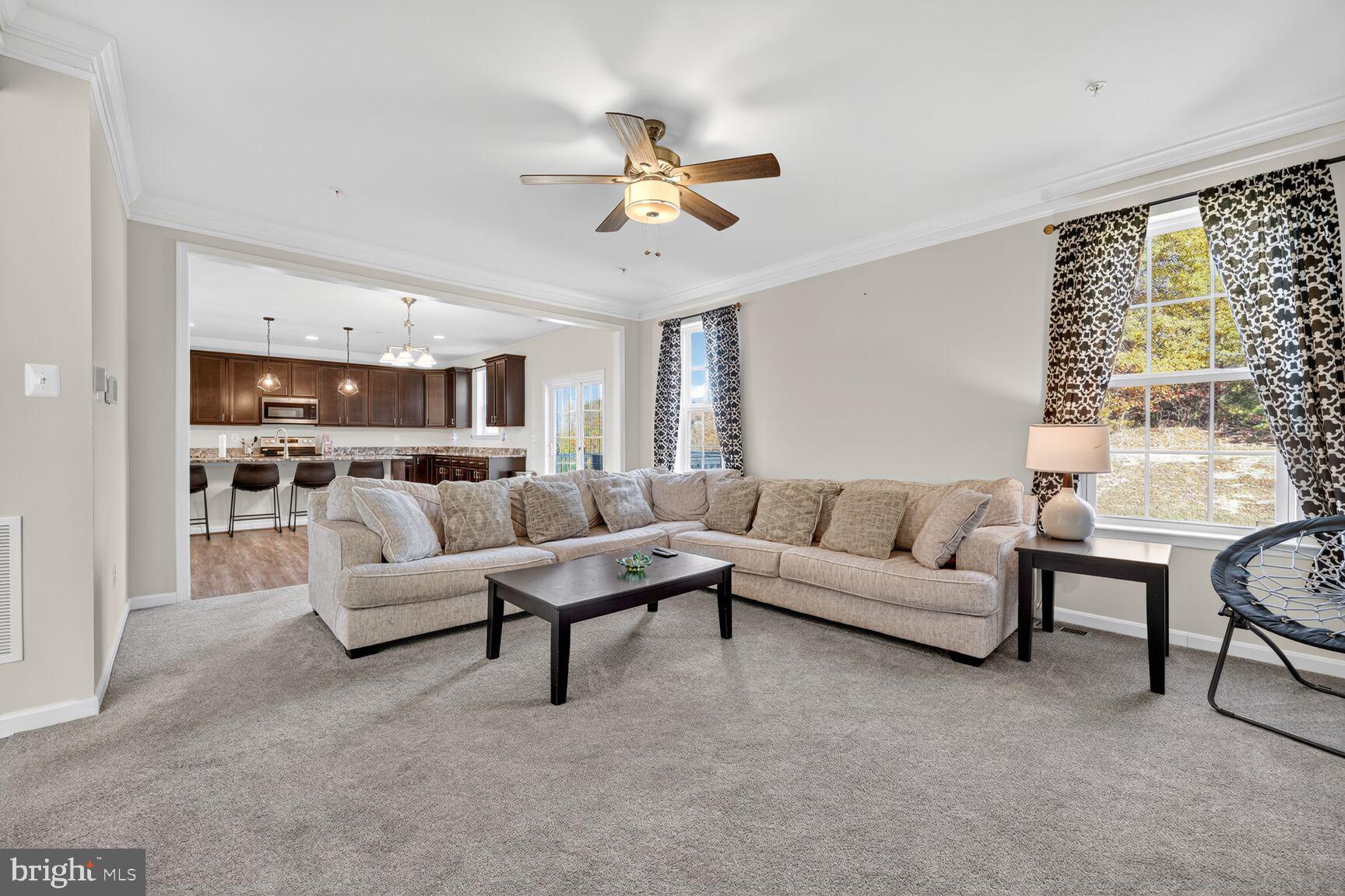 711 Yarrow Court Accokeek, MD 20607 - Photo 11 of 40 a living room with furniture and a large window