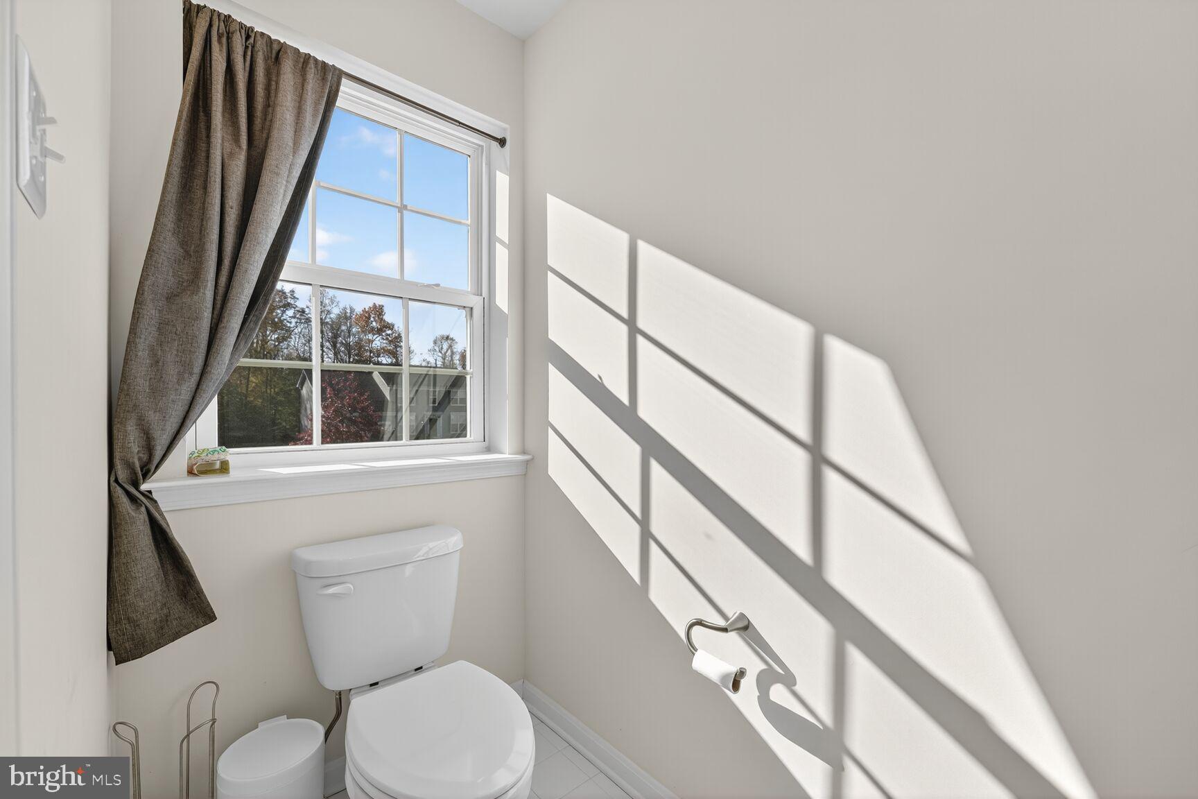 711 Yarrow Court Accokeek, MD 20607 - Photo 20 of 40 a white toilet sitting next to a window