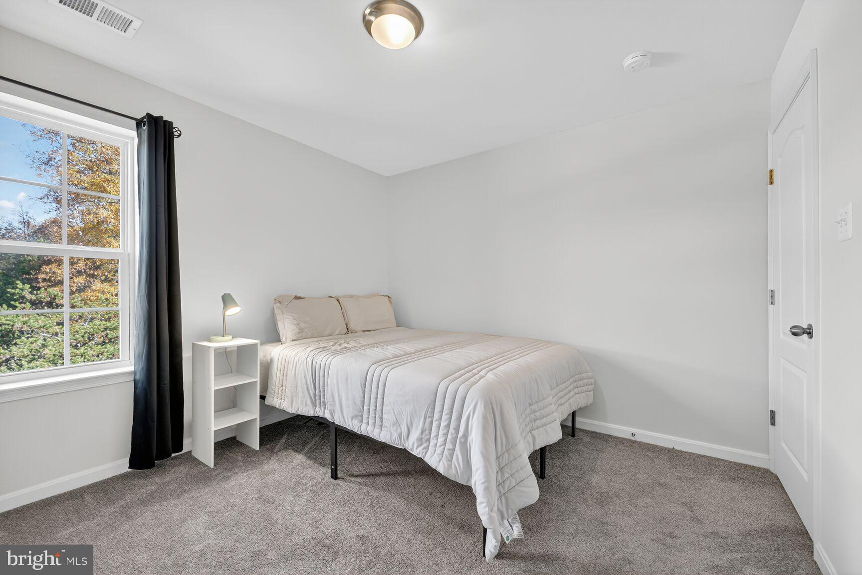 711 Yarrow Court Accokeek, MD 20607 - Photo 21 of 40 a bedroom with a bed and window