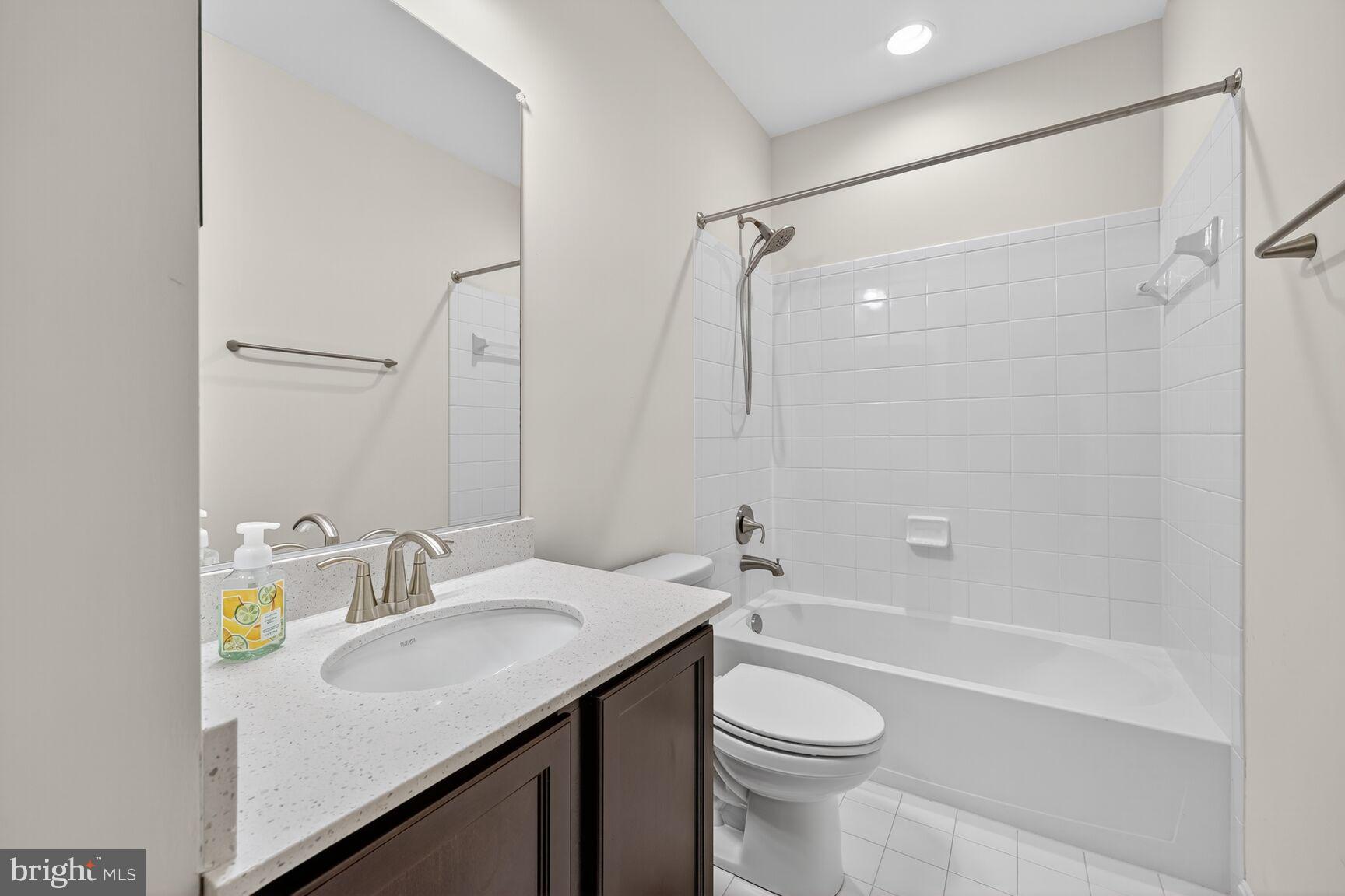 711 Yarrow Court Accokeek, MD 20607 - Photo 32 of 40 a bathroom with a sink a toilet and shower