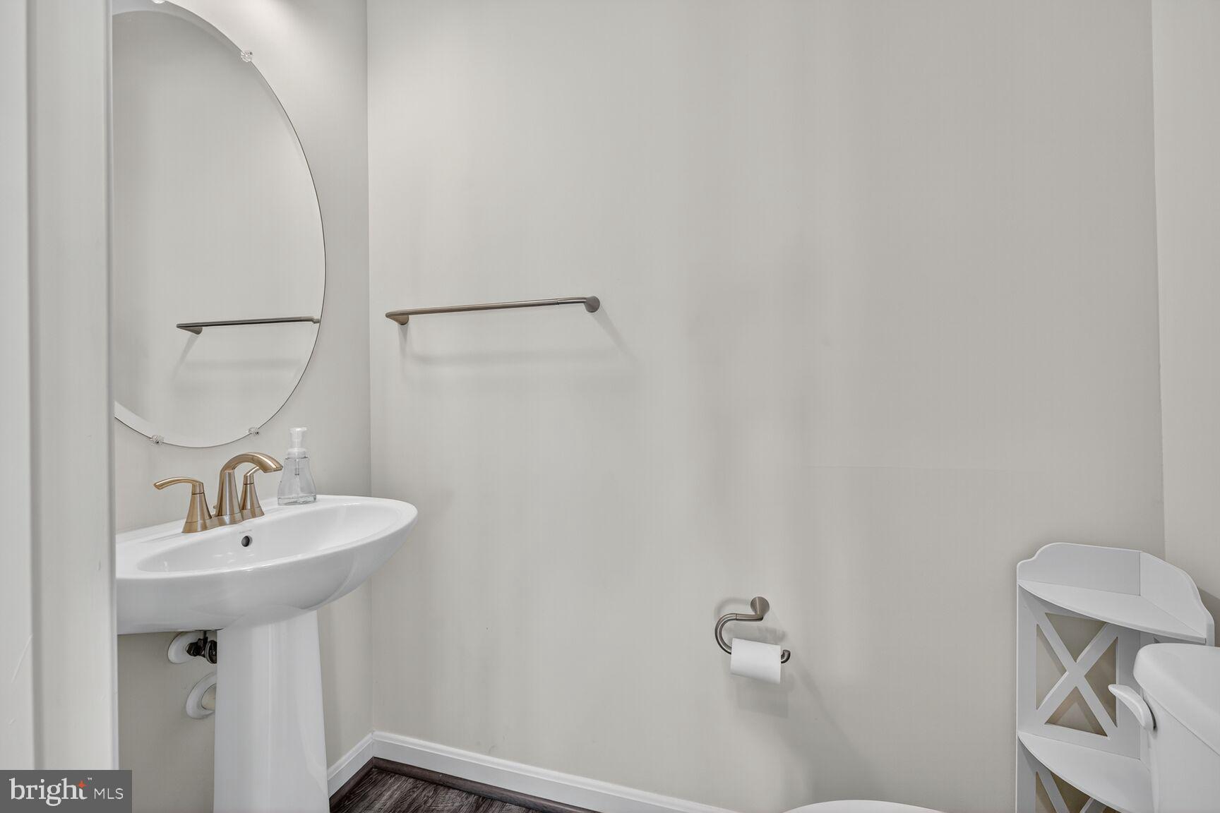 711 Yarrow Court Accokeek, MD 20607 - Photo 34 of 40 a bathroom with a sink a toilet