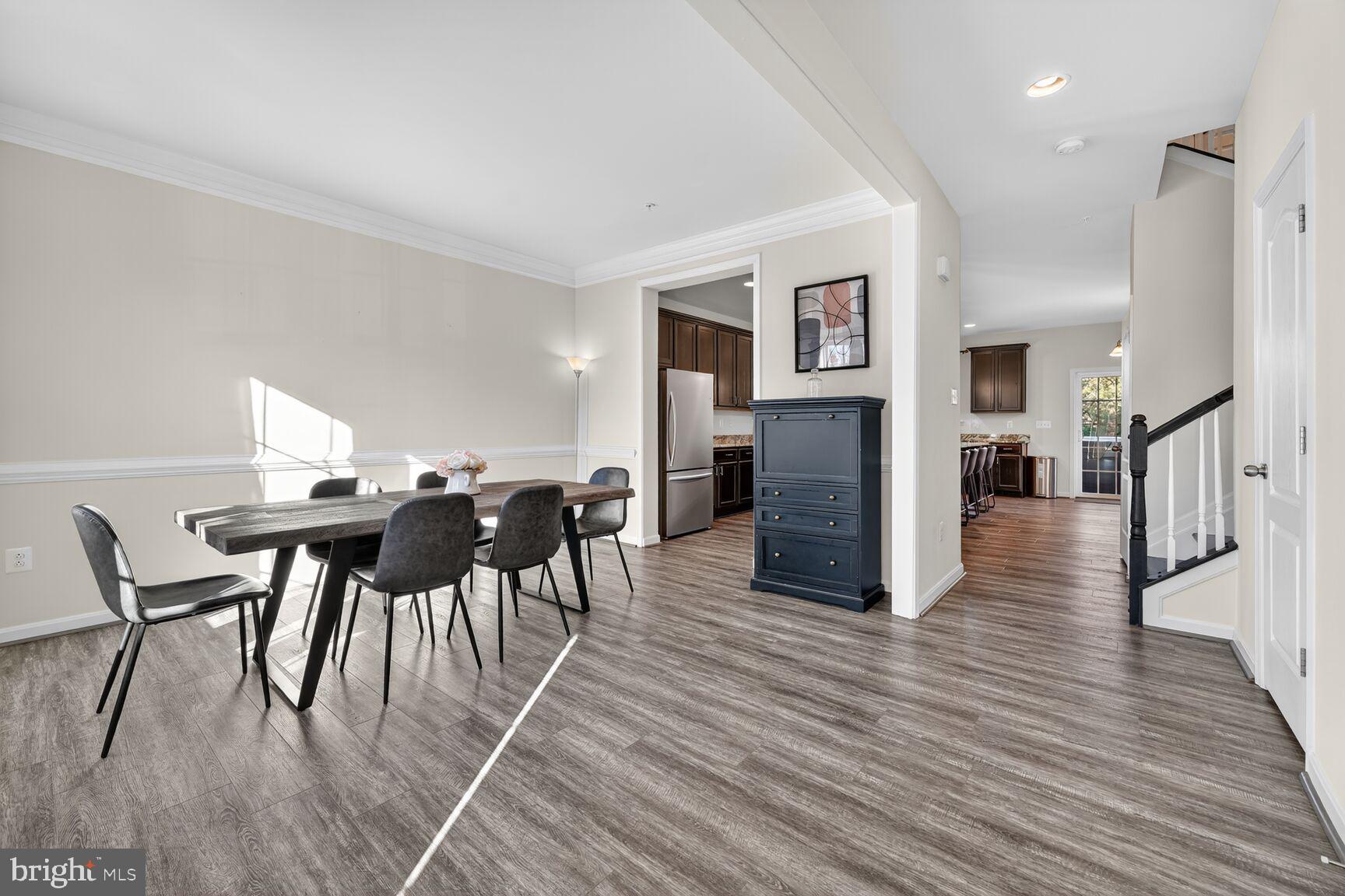711 Yarrow Court Accokeek, MD 20607 - Photo 8 of 40 a view of a dining room with furniture and wooden floor