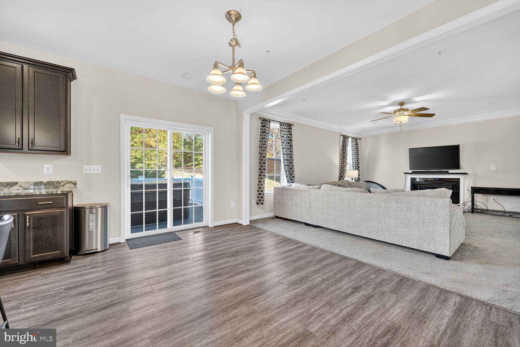 711 Yarrow Court Accokeek, MD 20607 - Photo 10 of 40 a living room with furniture and a fireplace