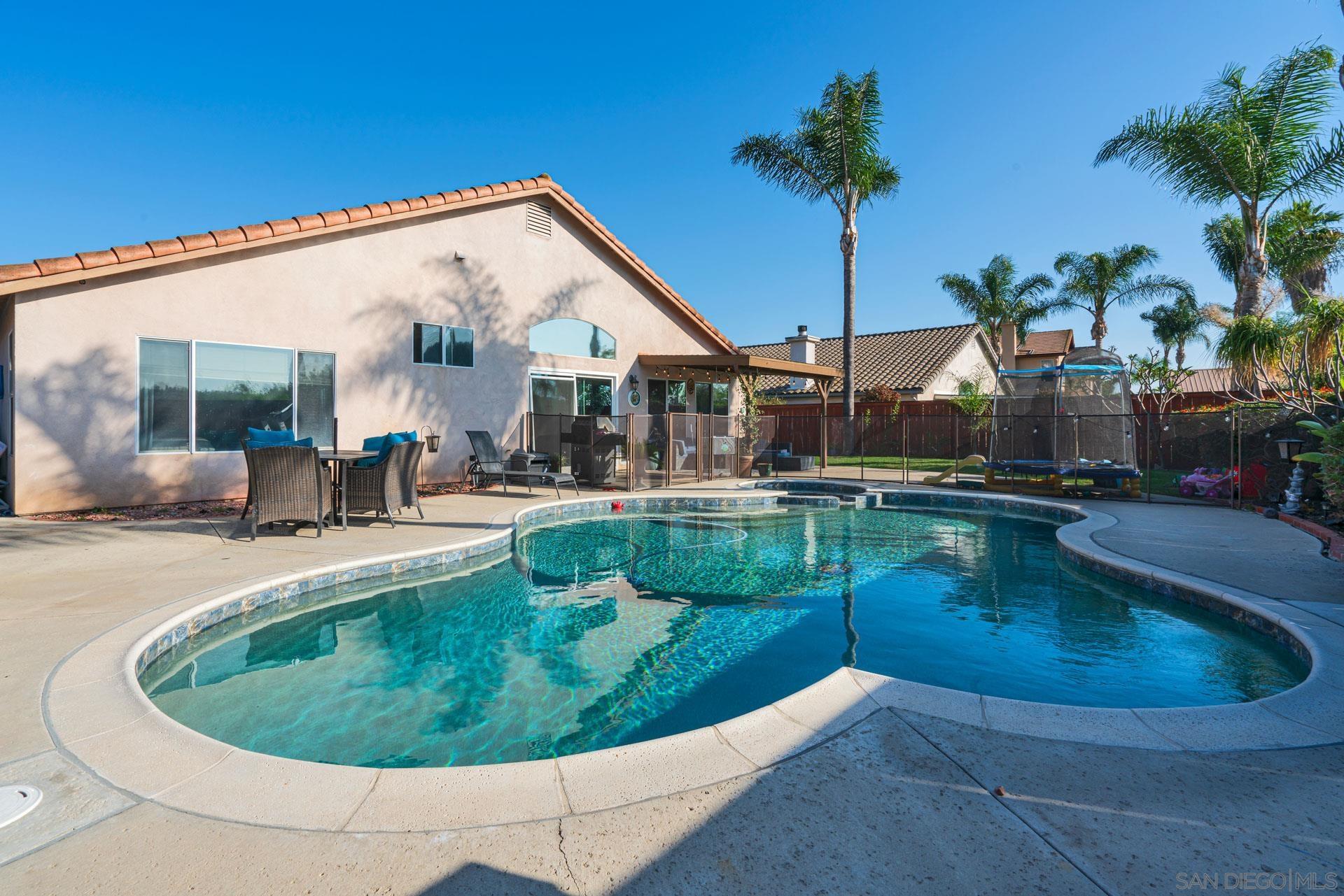 a view of a house with swimming pool