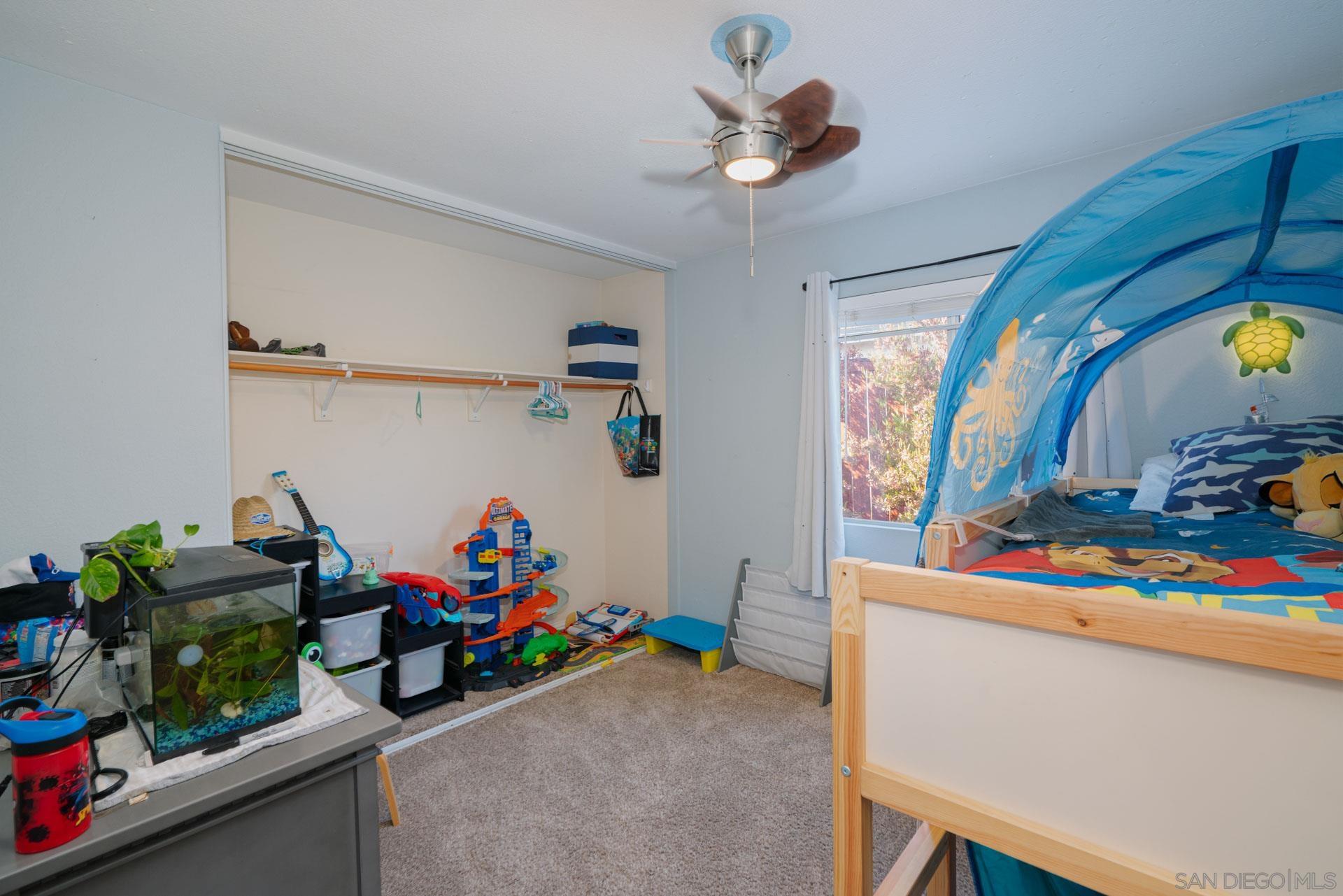 3396 Monique Lane Spring Valley, CA 91977 - Photo 14 of 31 a view of a dining room with a baby crib
