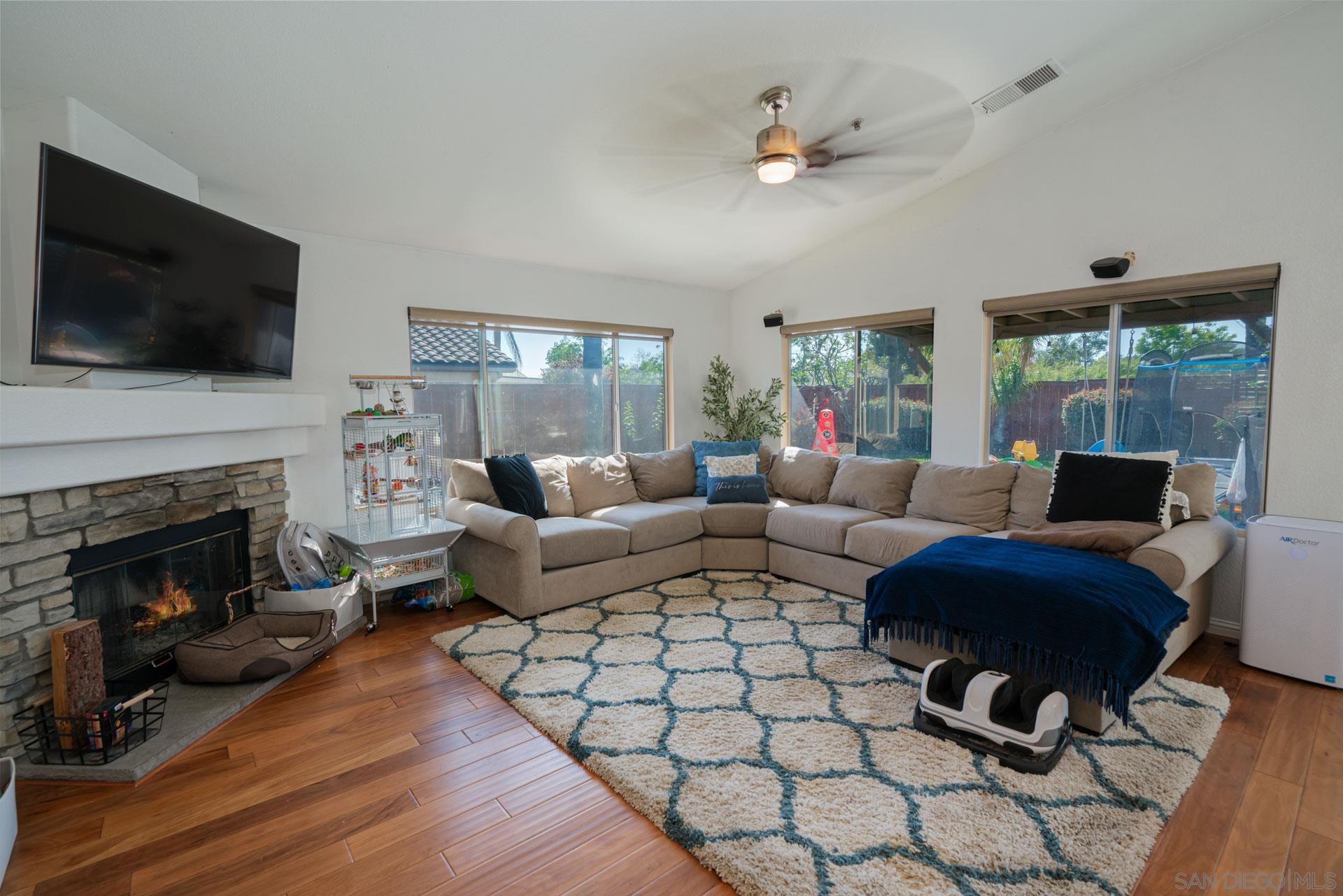 3396 Monique Lane Spring Valley, CA 91977 - Photo 31 of 31 a living room with furniture fireplace and flat screen tv