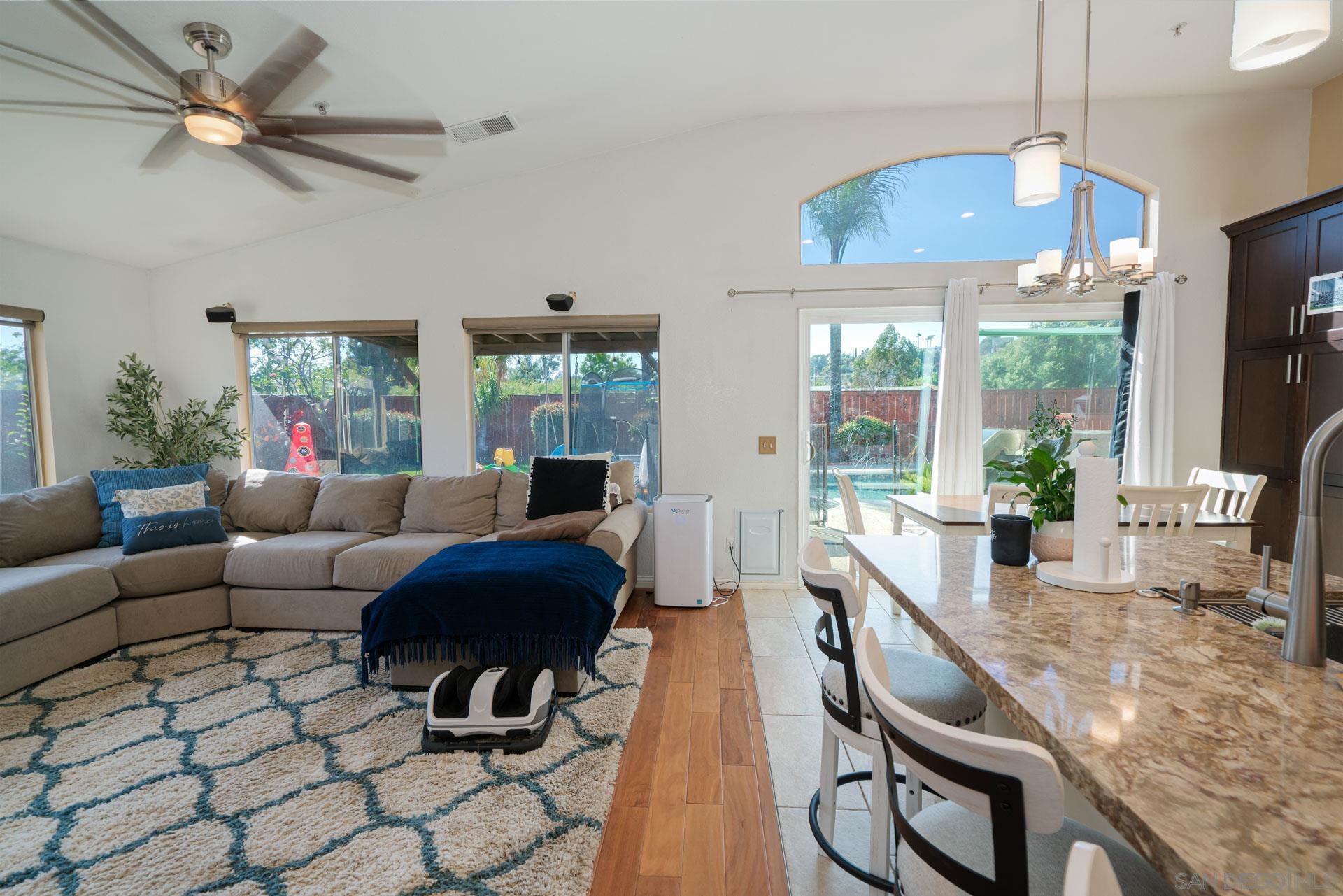 3396 Monique Lane Spring Valley, CA 91977 - Photo 6 of 31 a living room with furniture a flat screen tv and a large window