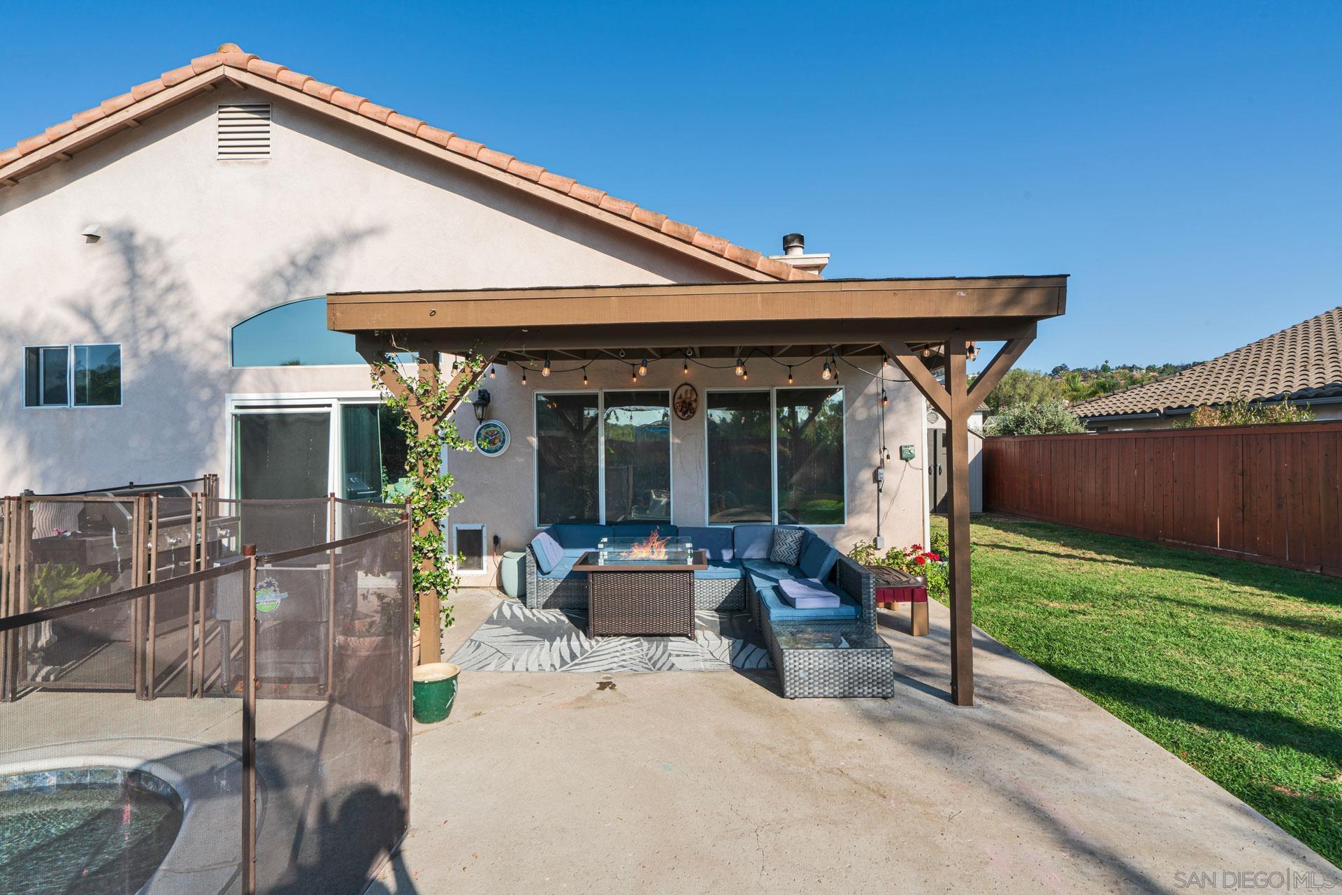 3396 Monique Lane Spring Valley, CA 91977 - Photo 7 of 31 a view of a house with backyard sitting area and garden