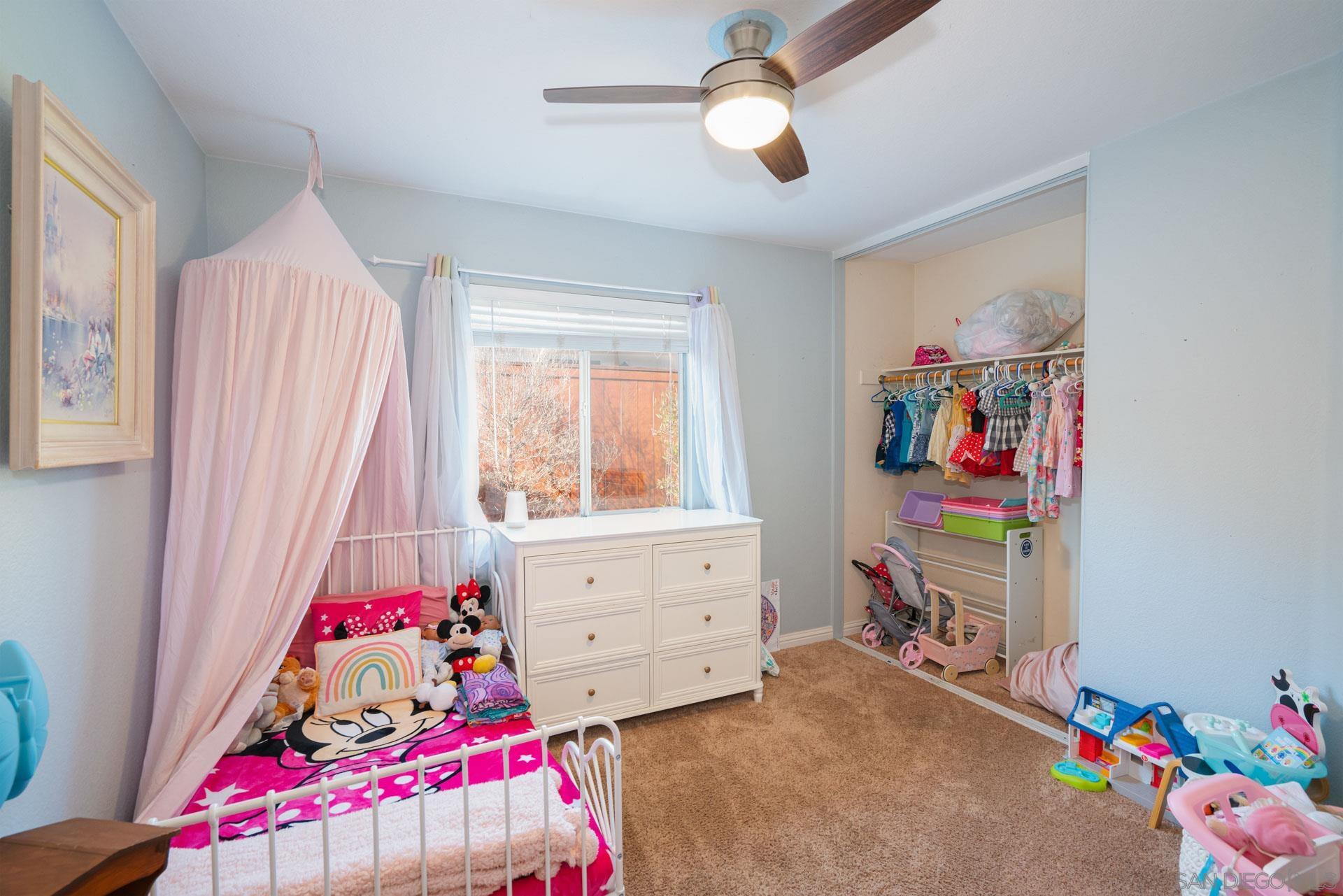 3396 Monique Lane Spring Valley, CA 91977 - Photo 10 of 31 a bedroom with furniture and a bed