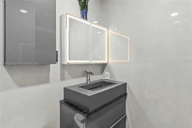 a kitchen with a sink cabinets and a window