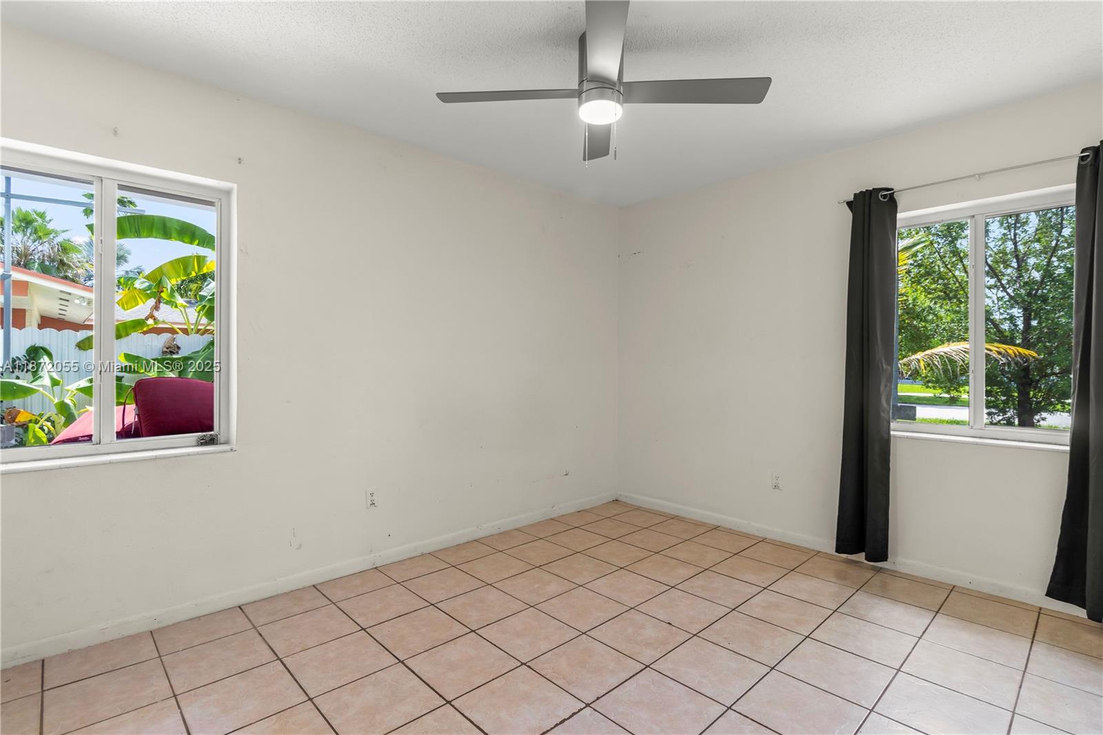 10615 Southwest 200th Street Cutler Bay, FL 33157 - Photo 16 of 35 an empty room with windows