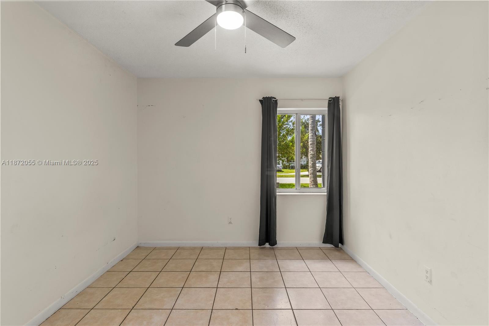 10615 Southwest 200th Street Cutler Bay, FL 33157 - Photo 17 of 35 a view of an empty room and window