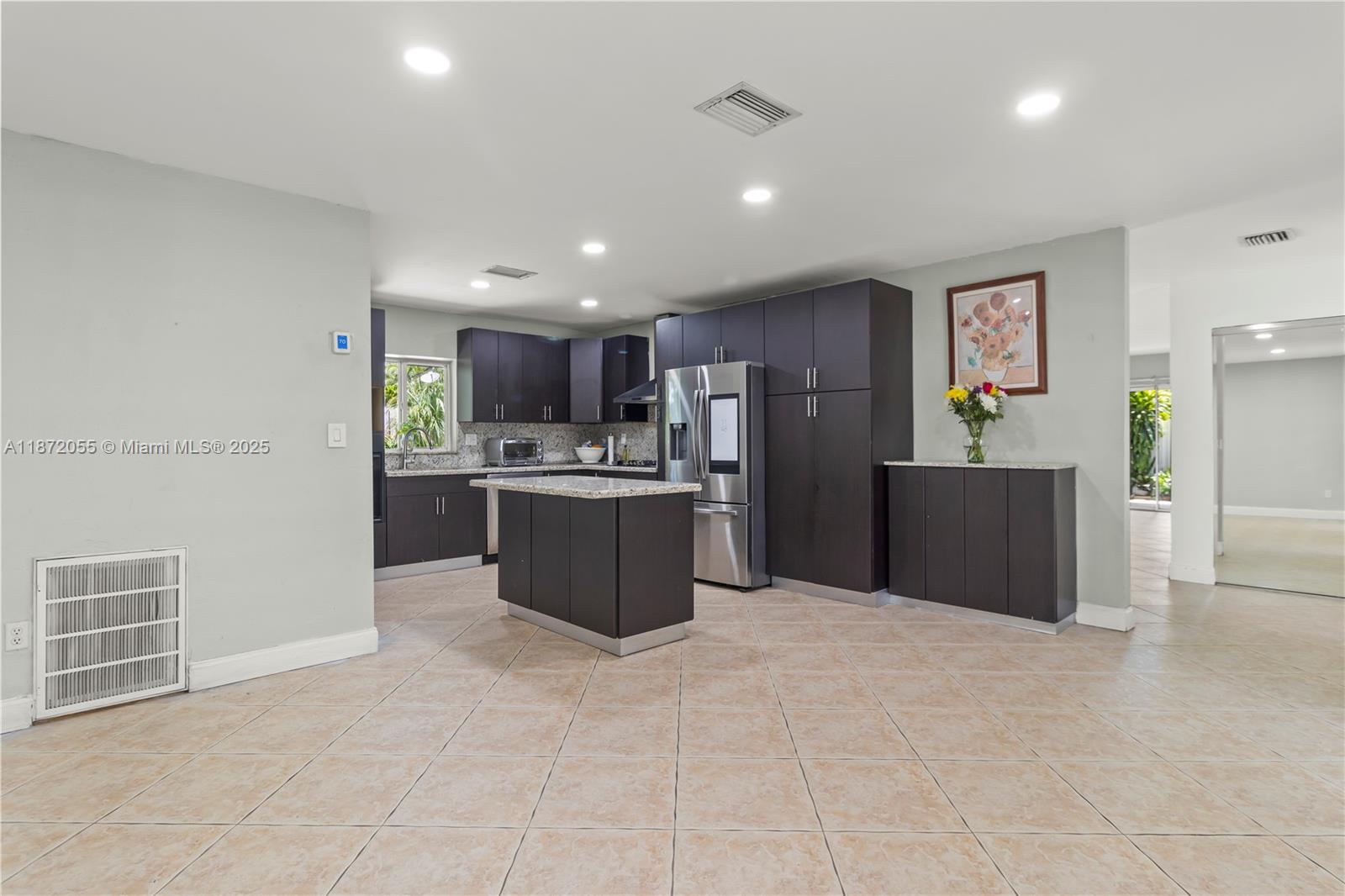 10615 Southwest 200th Street Cutler Bay, FL 33157 - Photo 27 of 35 a kitchen with stainless steel appliances a refrigerator sink and cabinets