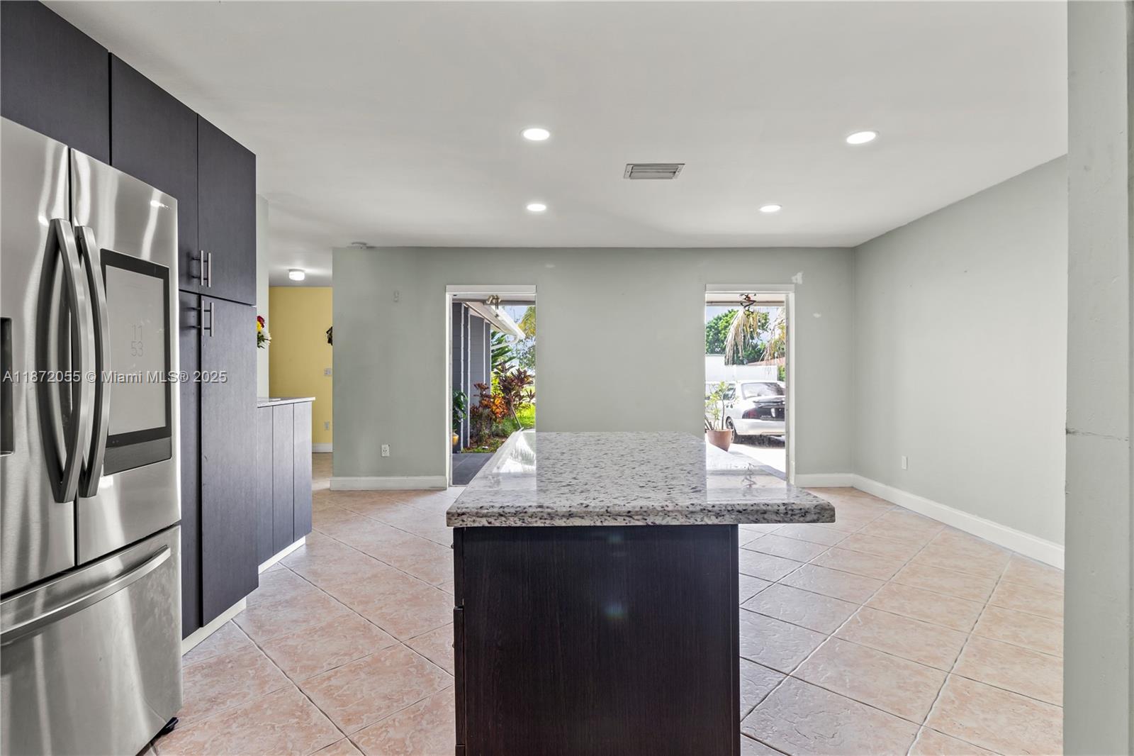 10615 Southwest 200th Street Cutler Bay, FL 33157 - Photo 30 of 35 a kitchen with stainless steel appliances granite countertop a refrigerator and a granite counter tops