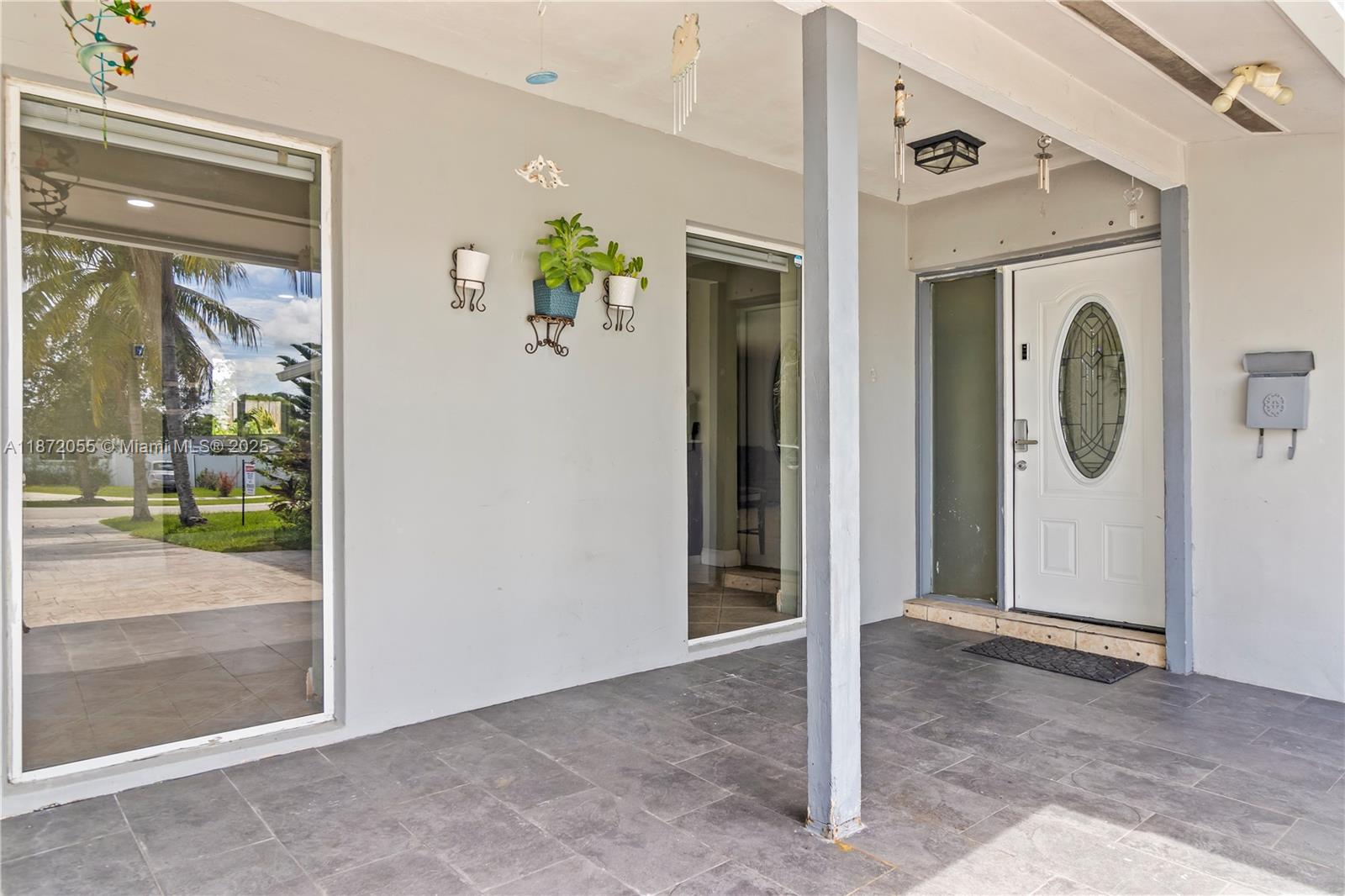 10615 Southwest 200th Street Cutler Bay, FL 33157 - Photo 3 of 35 a view of a hallway with washer and dryer