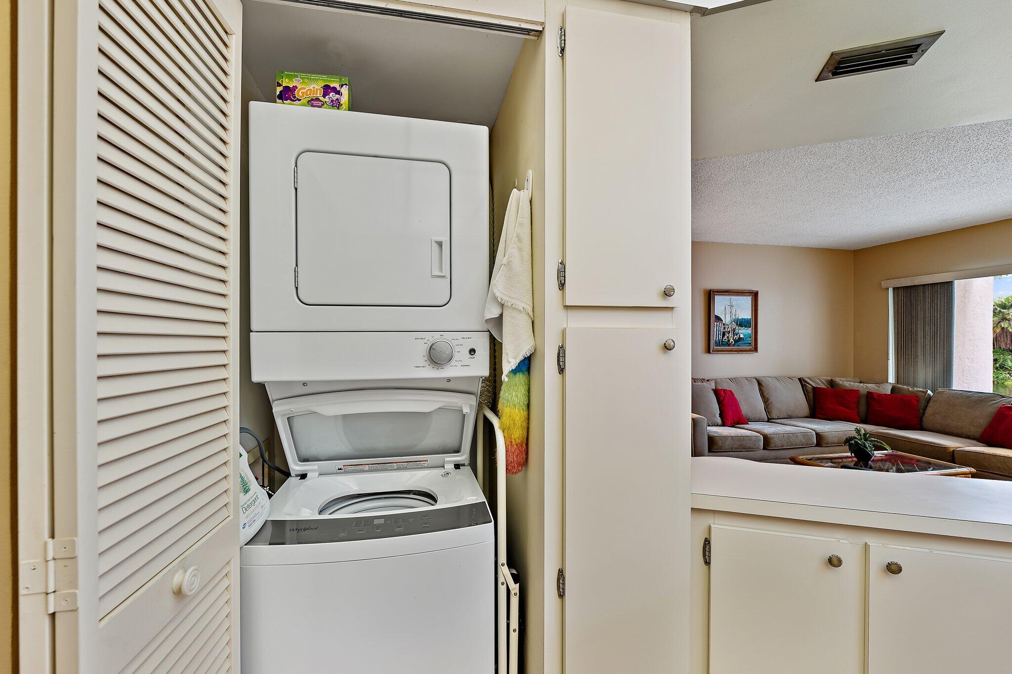 1605 Highway 1, Unit B104 Jupiter, FL 33477 - Photo 14 of 24 a utility room with dryer and washer