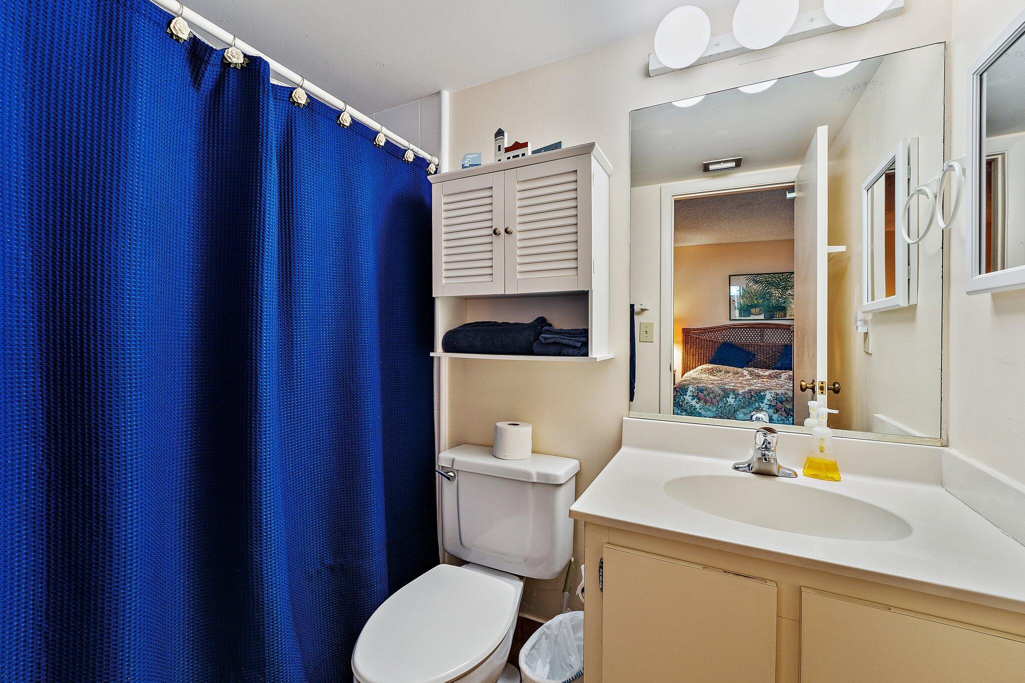 1605 Highway 1, Unit B104 Jupiter, FL 33477 - Photo 19 of 24 a bathroom with a sink a toilet and shower