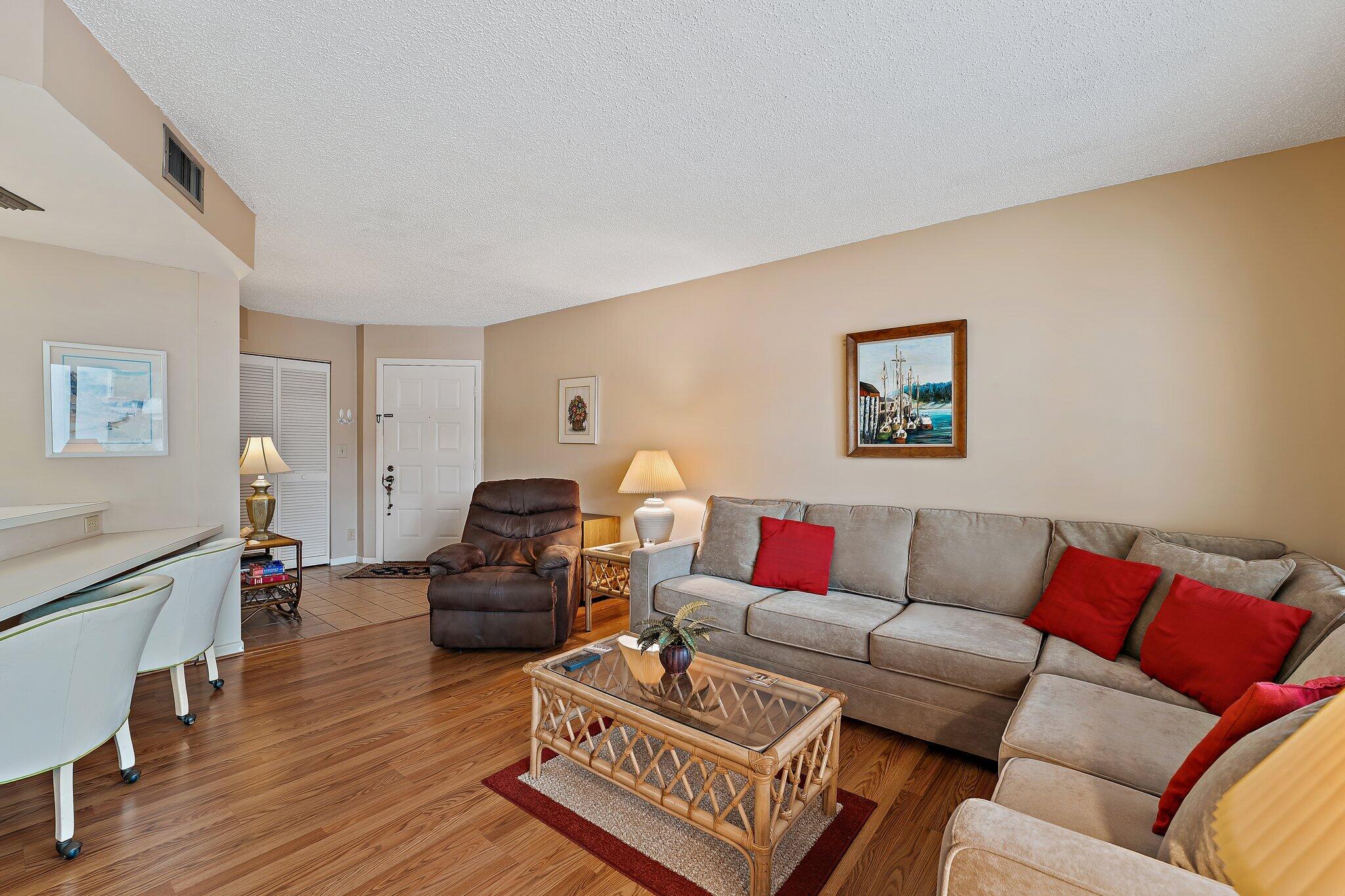 1605 Highway 1, Unit B104 Jupiter, FL 33477 - Photo 6 of 24 a living room with furniture
