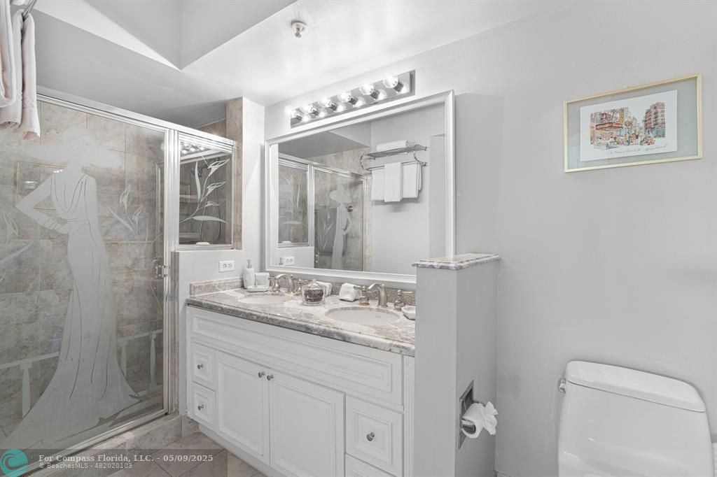 2417 Tuscany Way, Unit 2417 Boynton Beach, FL 33435 - Photo 18 of 27 a bathroom with a granite countertop sink mirror and double