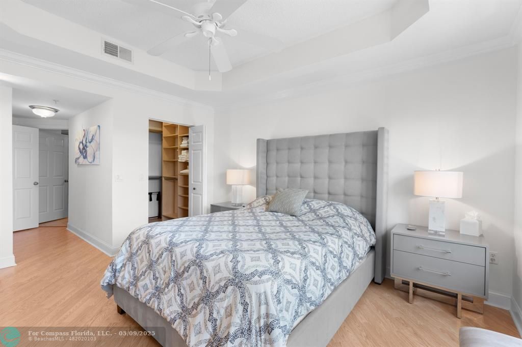 2417 Tuscany Way, Unit 2417 Boynton Beach, FL 33435 - Photo 20 of 27 a bedroom with a bed and a closet