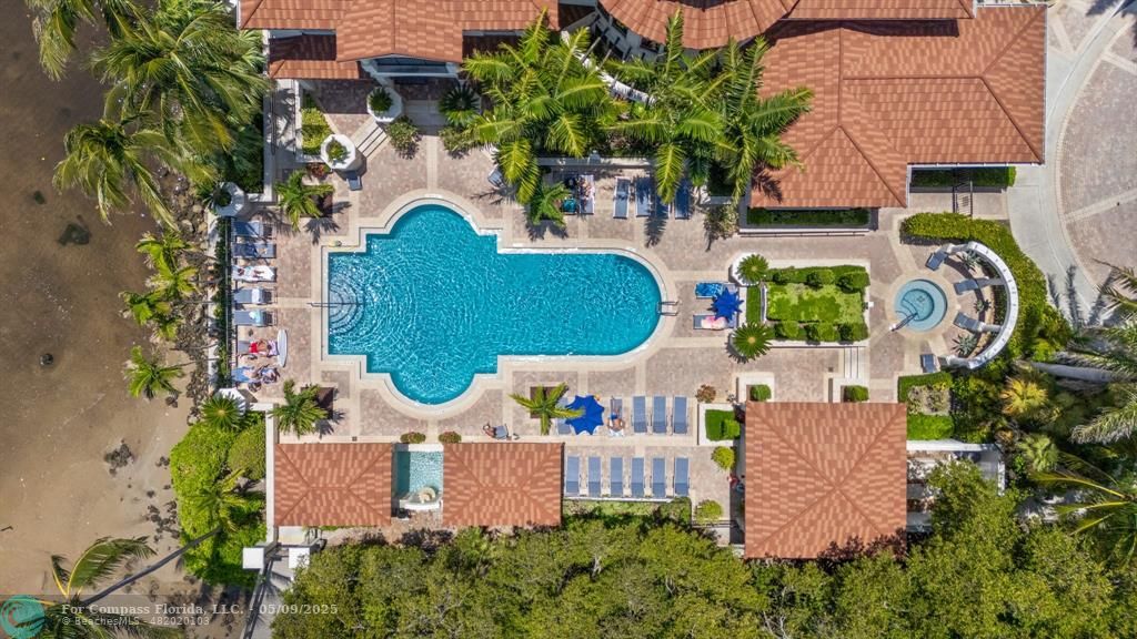 2417 Tuscany Way, Unit 2417 Boynton Beach, FL 33435 - Photo 25 of 27 an aerial view of a house with garden space and lake view