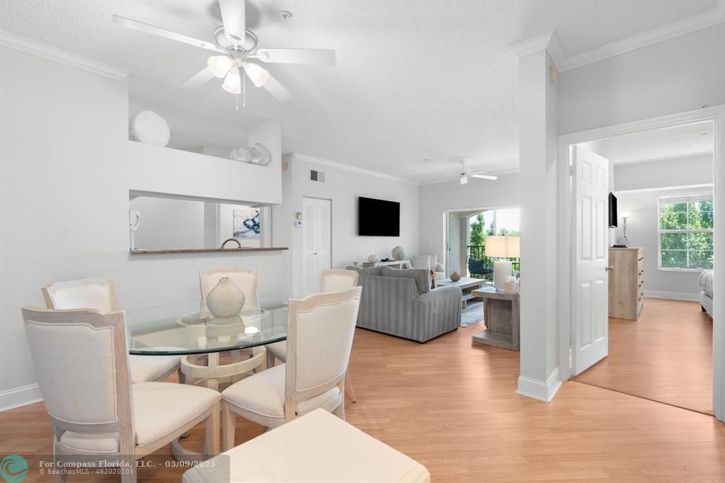 2417 Tuscany Way, Unit 2417 Boynton Beach, FL 33435 - Photo 3 of 27 a living room with fireplace furniture and a flat screen tv