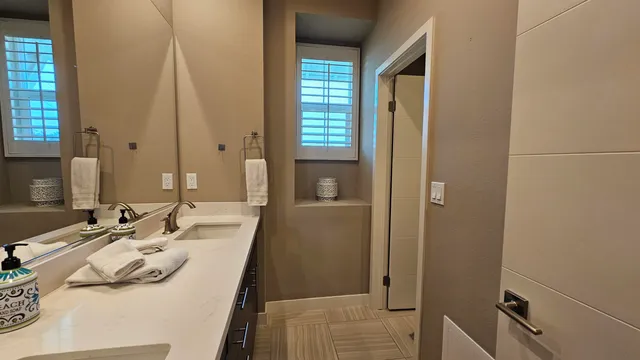 a view of backyard with plants and outdoor seating