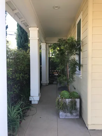 a backyard of a house with table and chairs