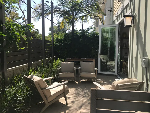 a outdoor living space with patio furniture and a potted plant