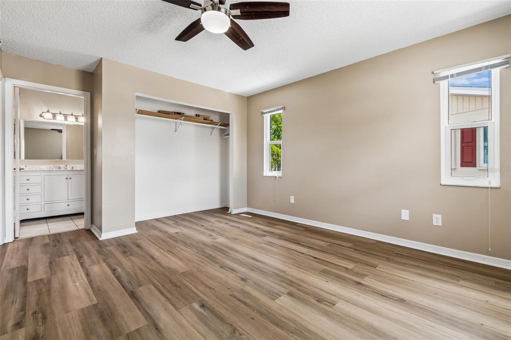 209 Genet Court Sun City Center, FL 33573 - Photo 19 of 31 a view of empty room with wooden floor and window