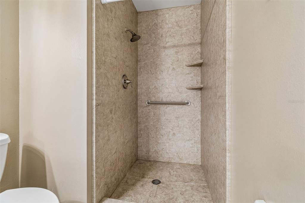 209 Genet Court Sun City Center, FL 33573 - Photo 21 of 31 a bathroom with a shower