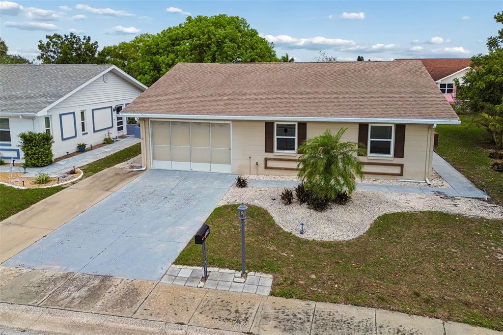209 Genet Court Sun City Center, FL 33573 - Photo 27 of 31 a aerial view of a house roof deck