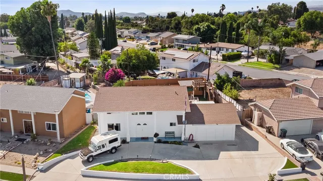 a aerial view of a house with swimming pool and ocean view