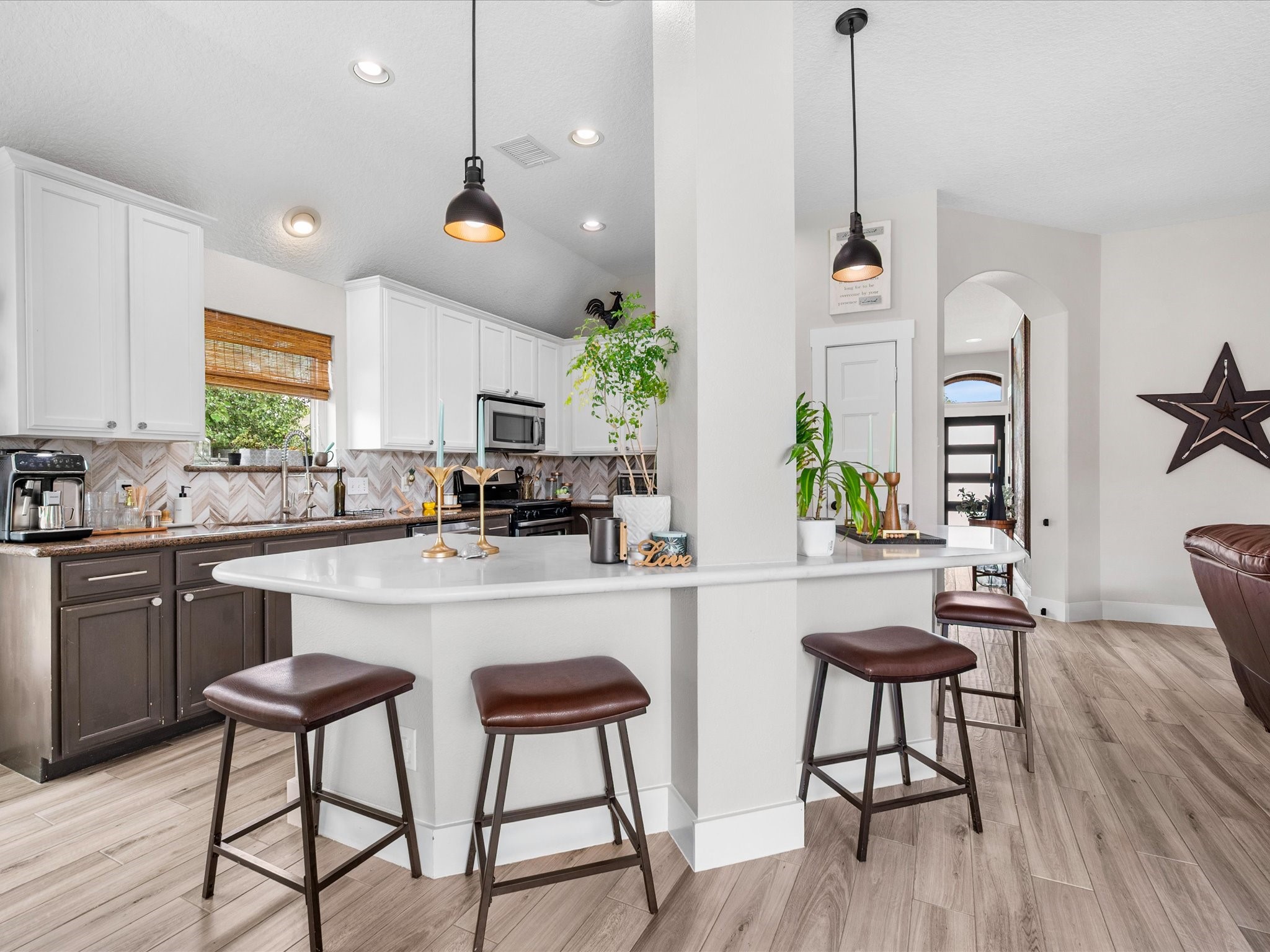 4023 Tigris Ridge Drive Katy, TX 77449 - Photo 13 of 39 The spacious kitchen is anchored by an oversized island with sleek, updated finishes and flows seamlessly into the main living areas.