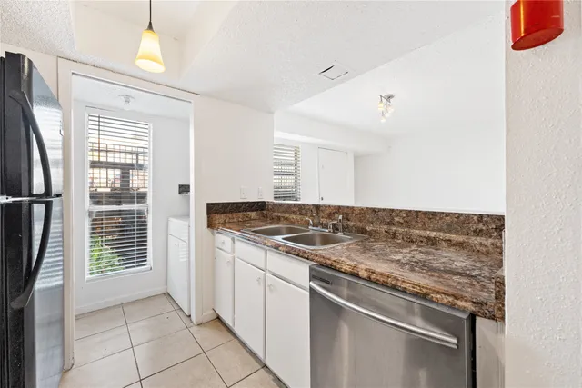 a kitchen with a stove and a refrigerator