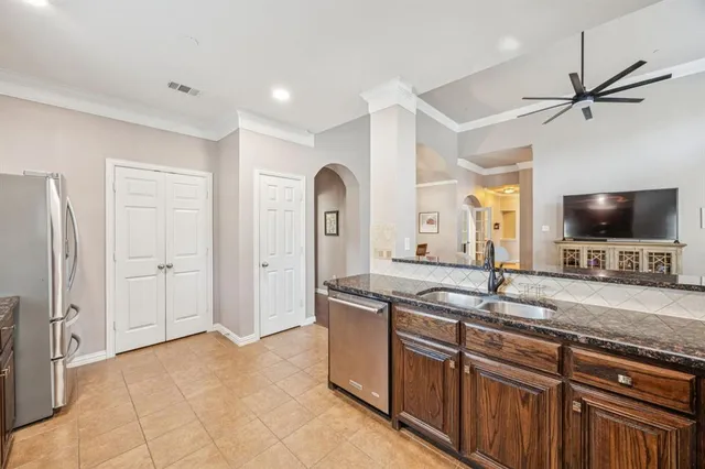 a spacious bathroom with a granite countertop sink and a mirror