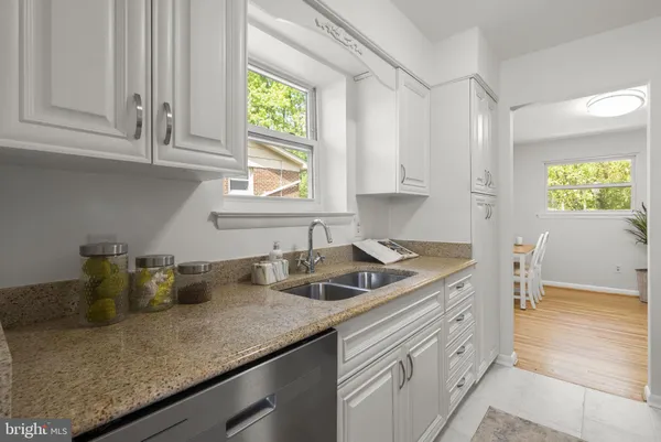 a kitchen with sink cabinets and window