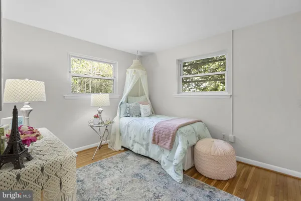 a bedroom with bed and a window