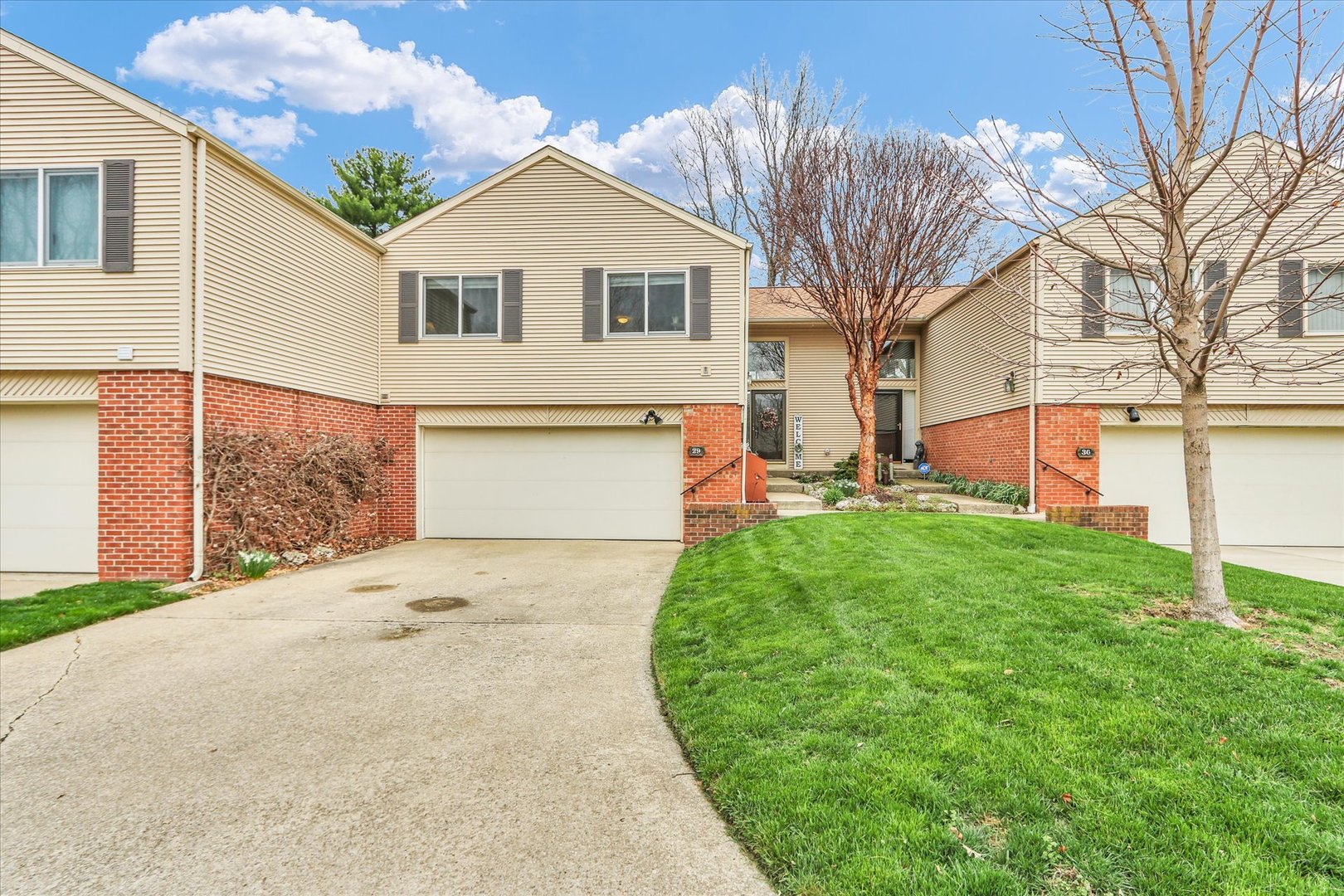 29 Fields East Champaign, IL 61822 - Photo 1 of 46 a front view of a house with garden