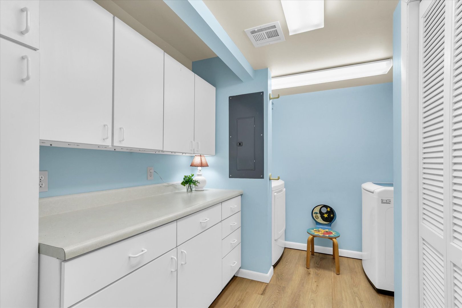 29 Fields East Champaign, IL 61822 - Photo 30 of 46 a view of a kitchen with a sink and wooden floor