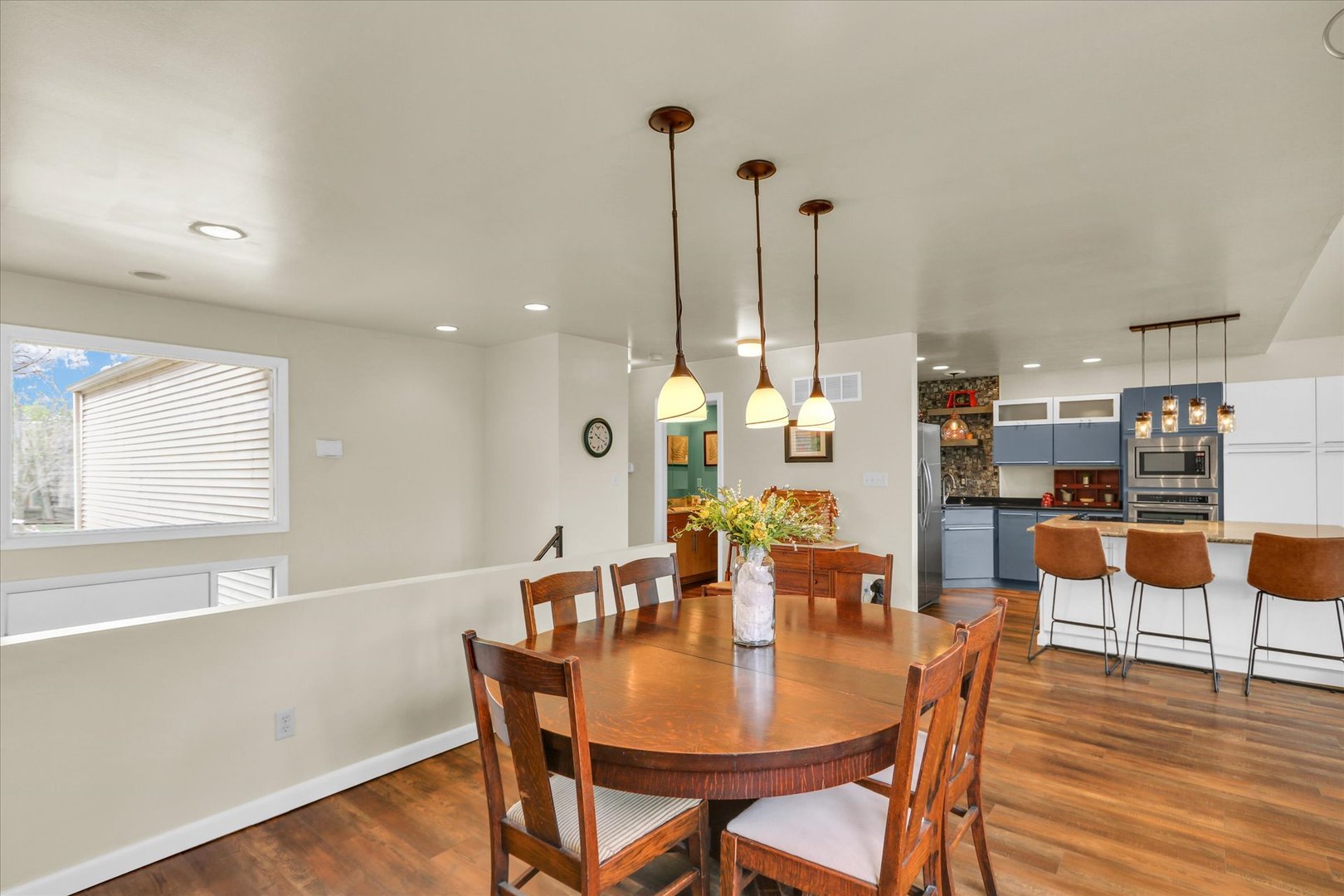29 Fields East Champaign, IL 61822 - Photo 10 of 46 a view of a dining room with furniture and wooden floor
