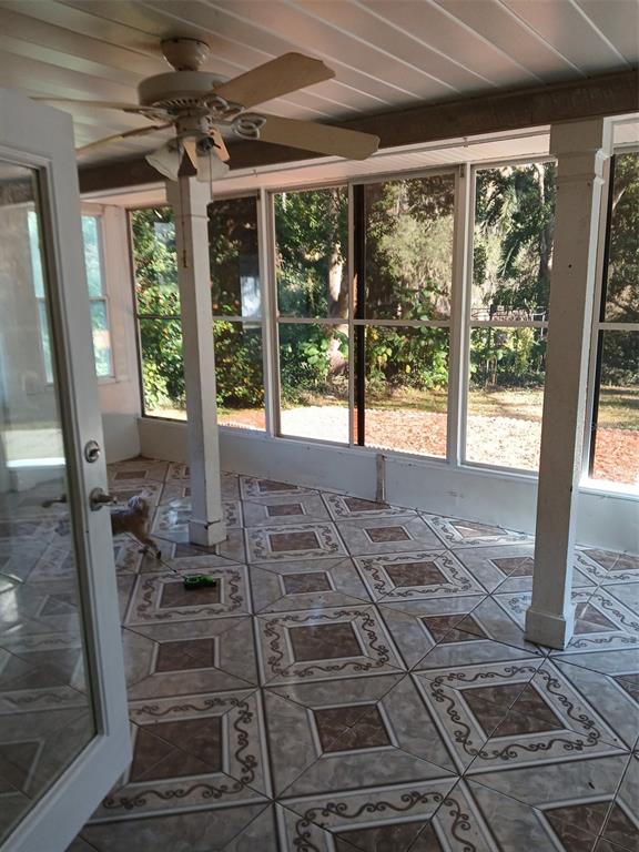 8809 Avondale Lane Hudson, FL 34667 - Photo 12 of 20 a living room with large windows