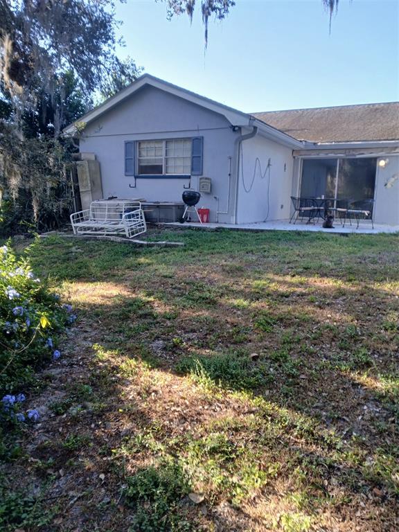 8809 Avondale Lane Hudson, FL 34667 - Photo 19 of 20 a view of a house with a yard