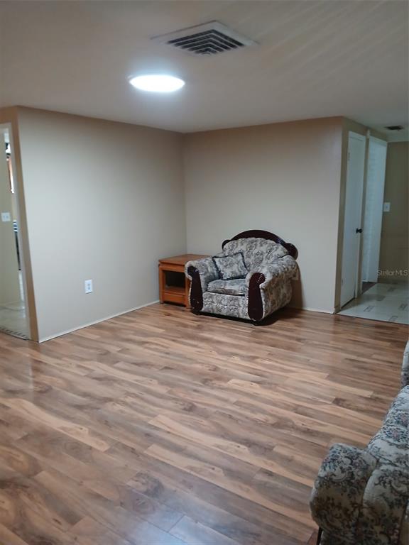 8809 Avondale Lane Hudson, FL 34667 - Photo 4 of 20 a view of a livingroom with wooden floor