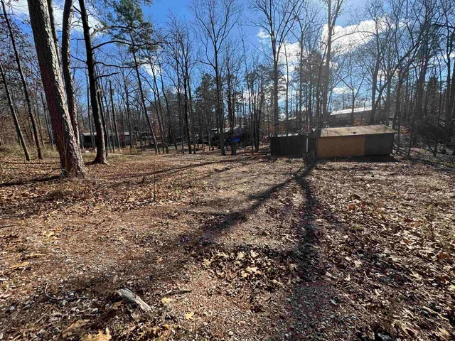 a backyard of a house with trees