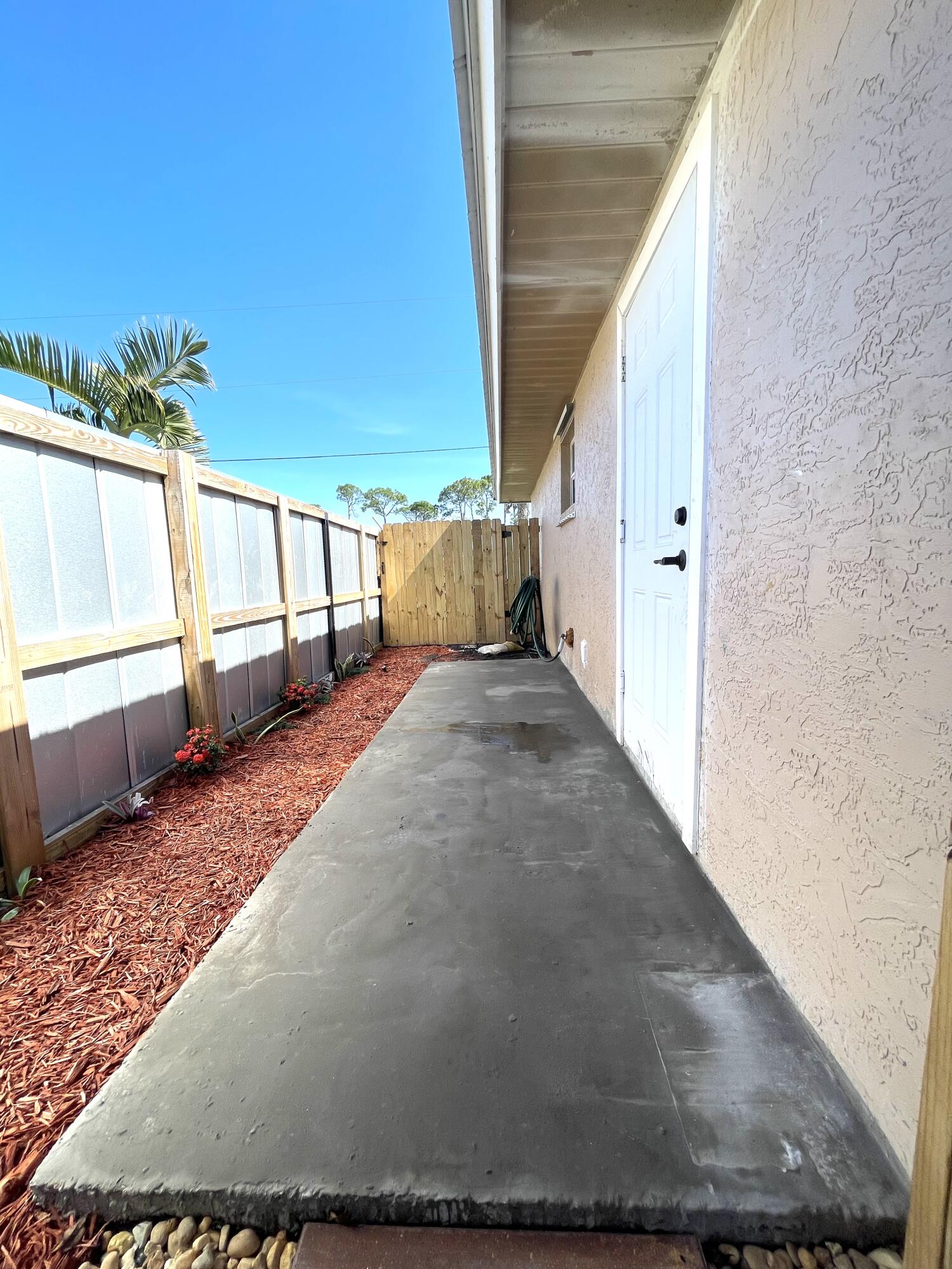 5753 Southeast Mercedes Avenue Stuart, FL 34997 - Photo 23 of 24 a view of a porch