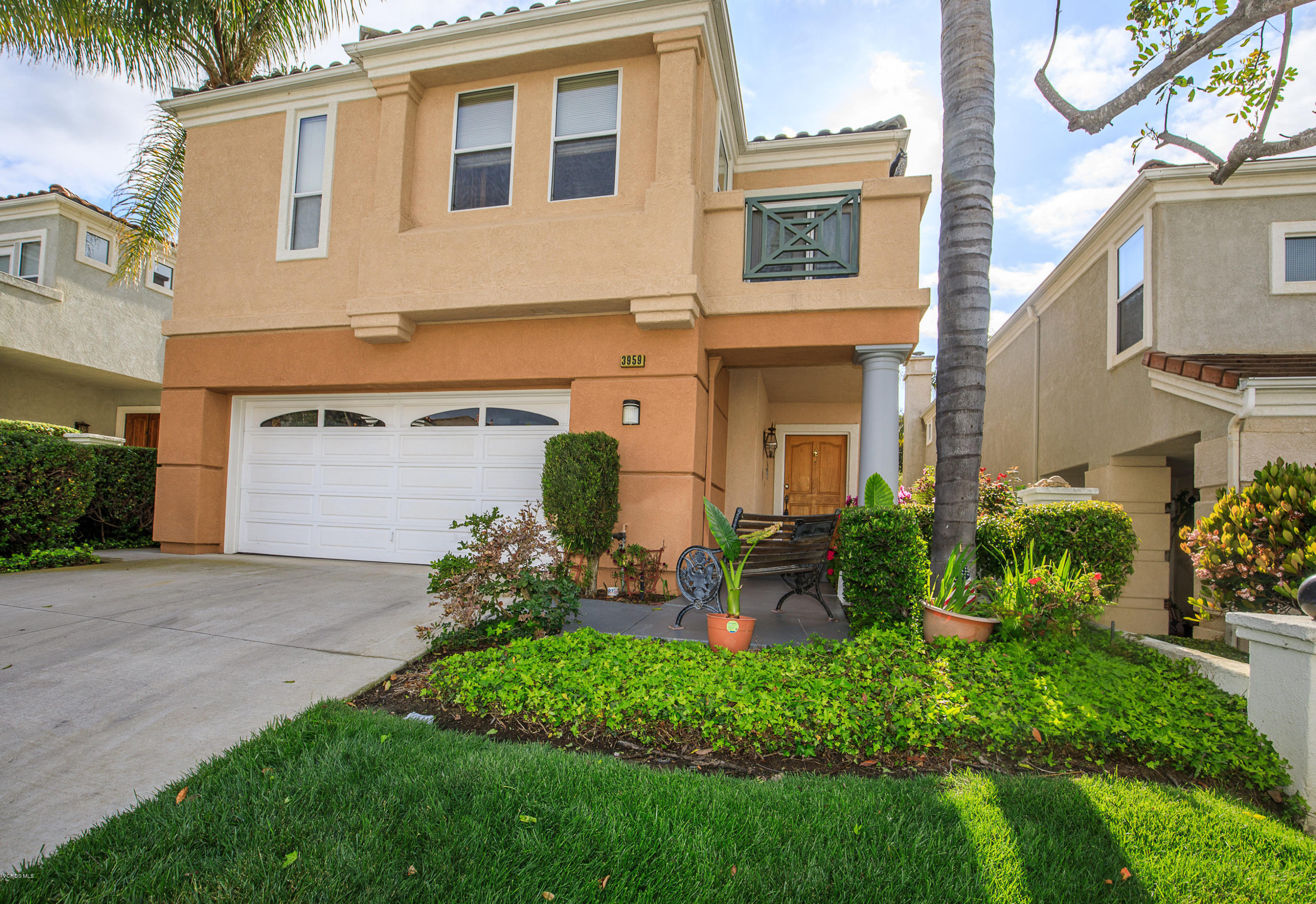 3959 Timberridge Road Moorpark, CA 93021 - Photo 2 of 48 a front view of a house with a garden and plants