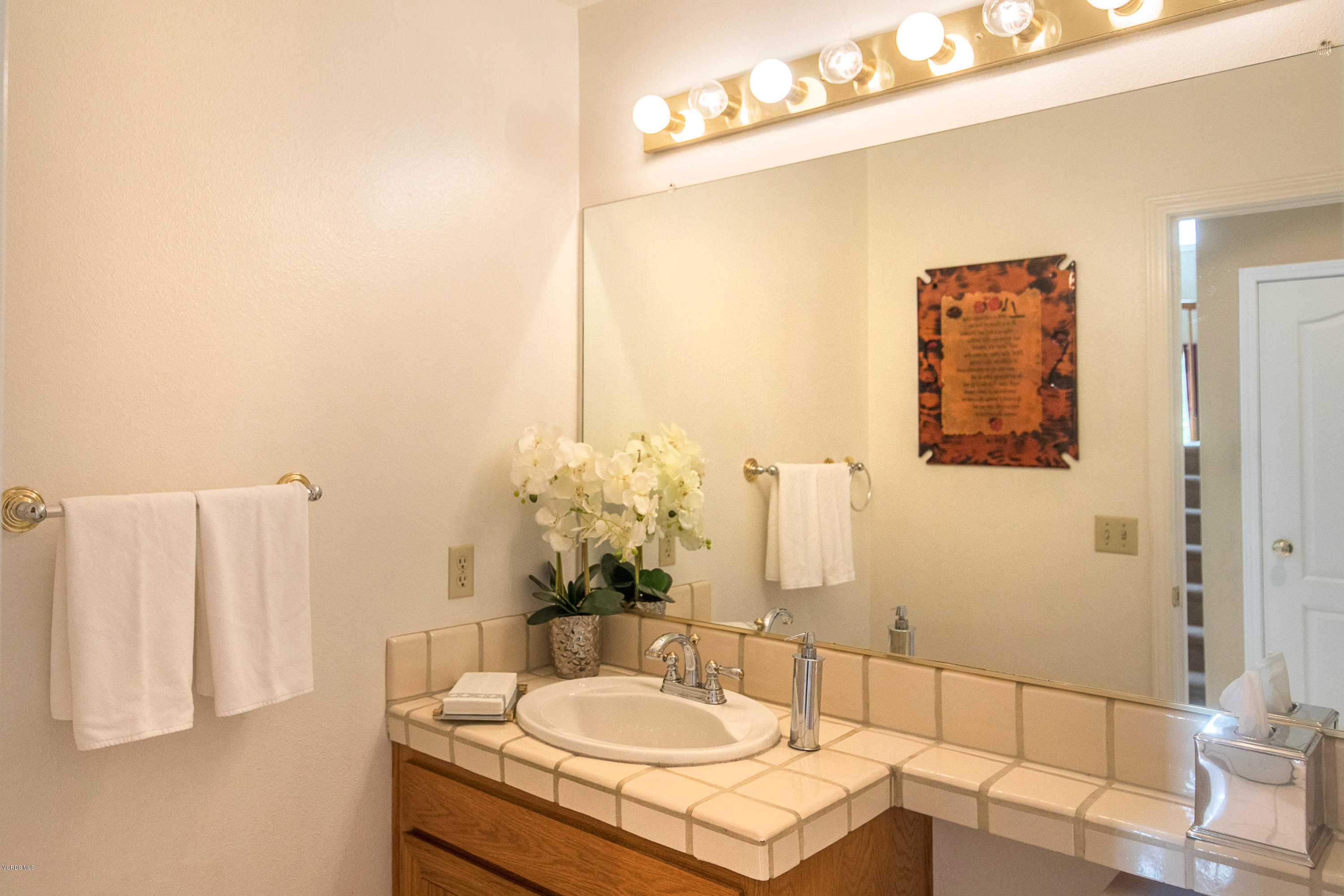 3959 Timberridge Road Moorpark, CA 93021 - Photo 20 of 48 a bathroom with a sink and a mirror