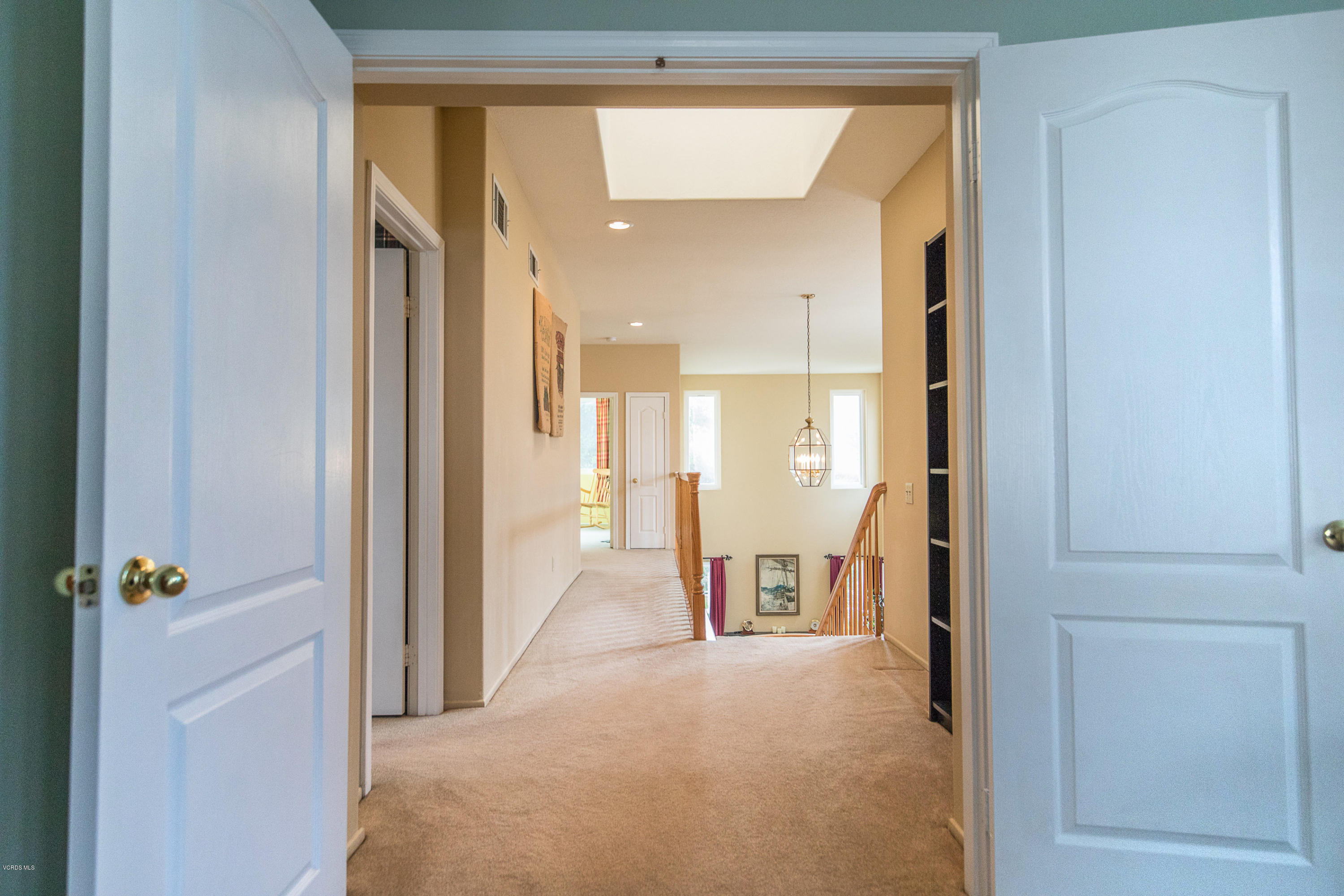 3959 Timberridge Road Moorpark, CA 93021 - Photo 22 of 48 a view of a hallway with wooden shelves